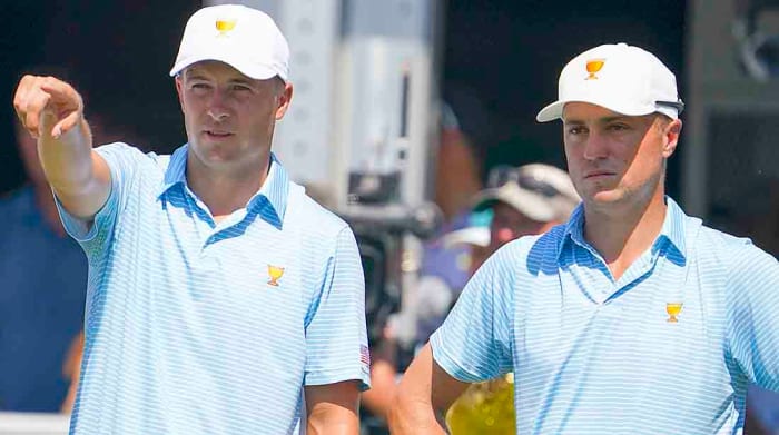 Jordan Spieth and Justin Thomas look on from the first tee on the opening day at the 2022 Presidents Cup.